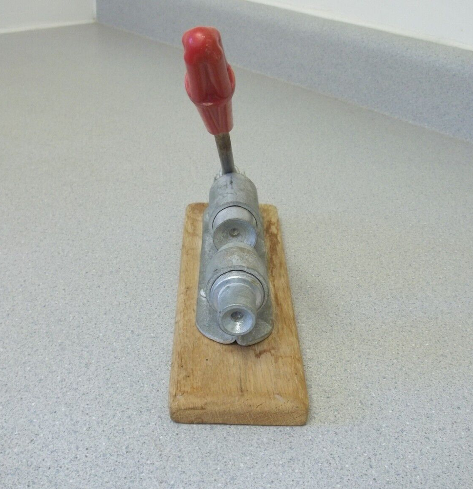 Nutcracker with red handle knob on wooden base Vintage adjustable nutcracker