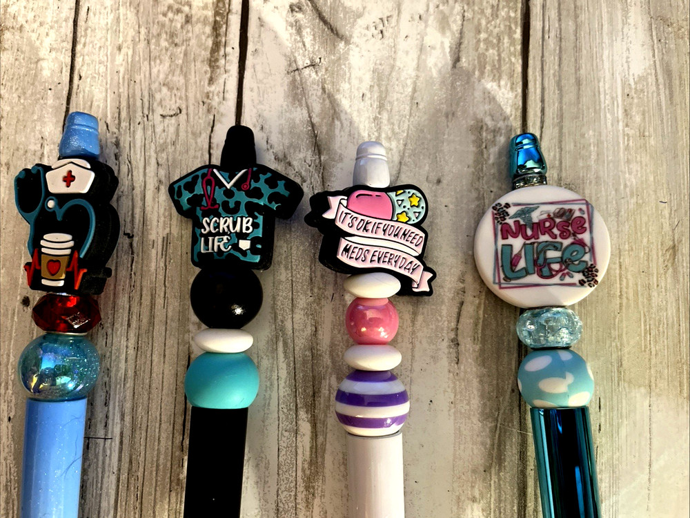4 miscellaneous beaded pens with 1 ink refill each