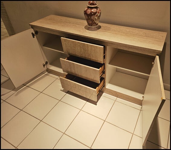 Spacious sideboard with three sliding drawers, two shelved cabinet compartments