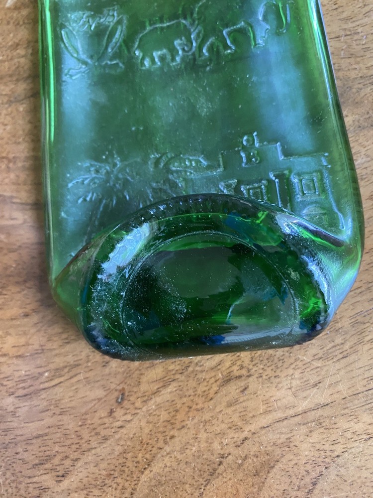 Squashed Green Glass Bottle 23 cms Long with Oriental Design