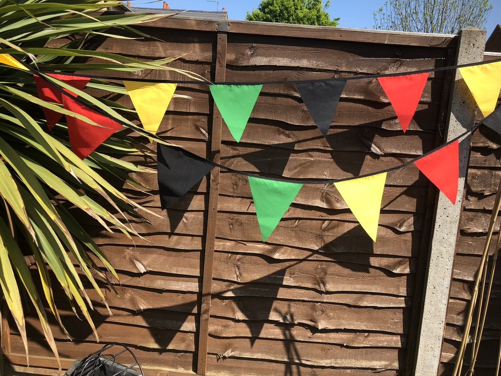 RASTAFARIAN COLOURED FABRIC BUNTING , COLOUR VISIBLE ON BOTH SIDES.
