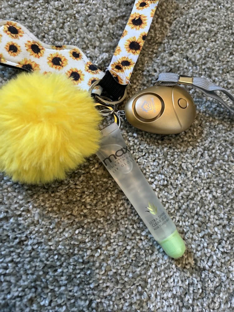 This is a sunflower-patterned self-defense keychain set