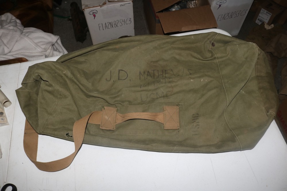 Original late WWII USMC marked transitional colored duffel bag named
