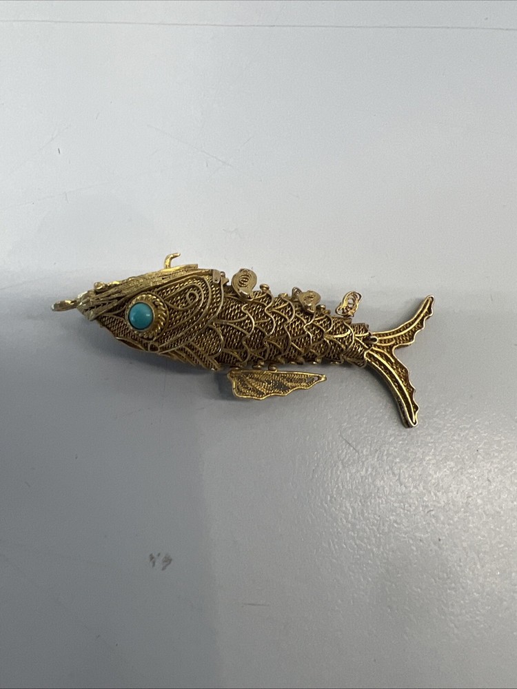 Tested as silver and gilded flexible fish, possibly pill box.