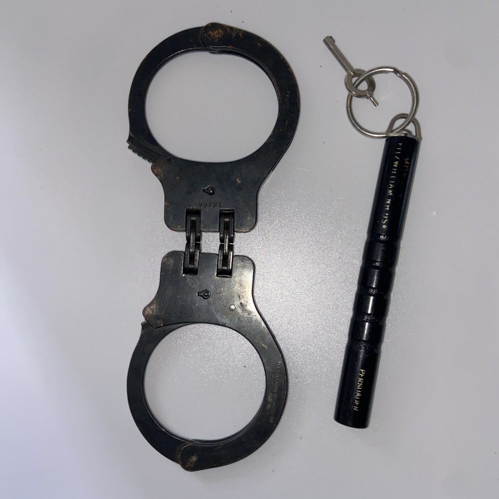 Vintage Peerless Hinge-Linked Handcuffs & Key On Monadnock Persuader