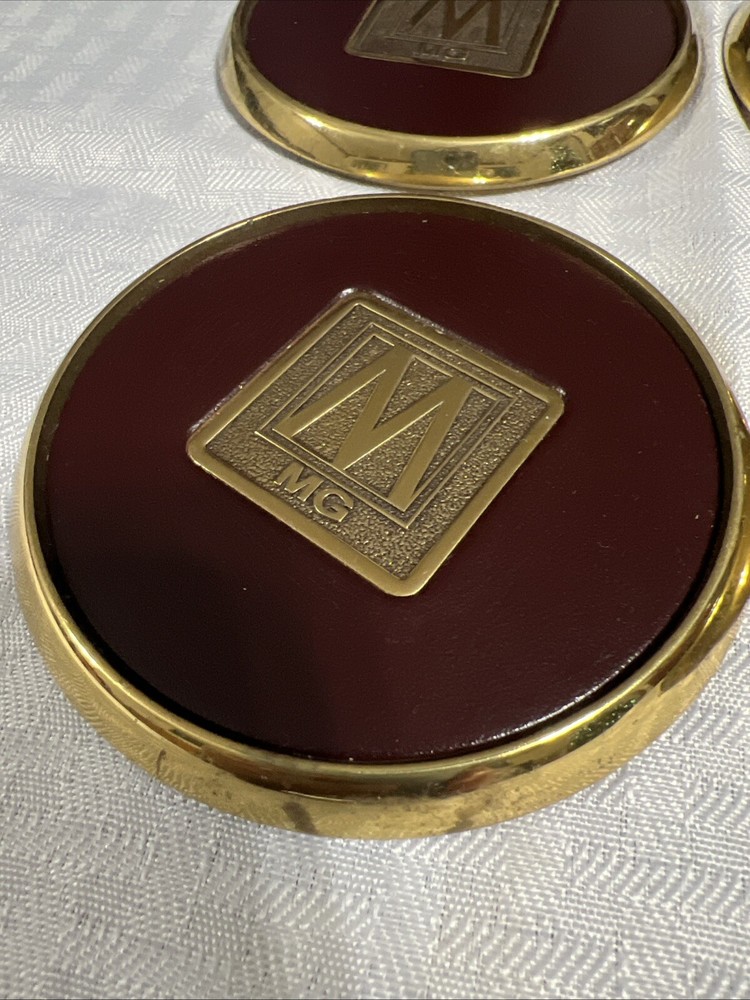 8 Vintage Solid BRASS and Brown LEATHER M MG COASTERS