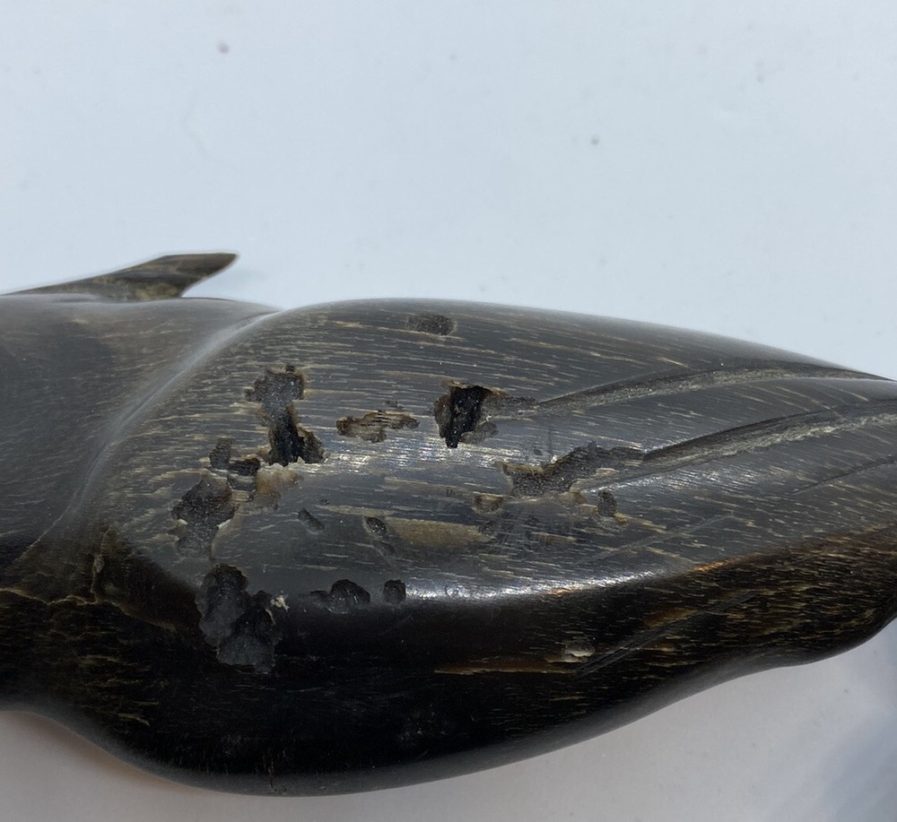 carved parrot on perch