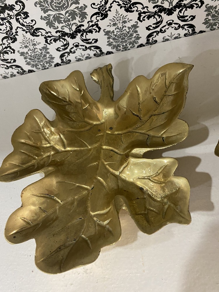 two beautiful solid brass leaf design wall decor. 7 inches tall.