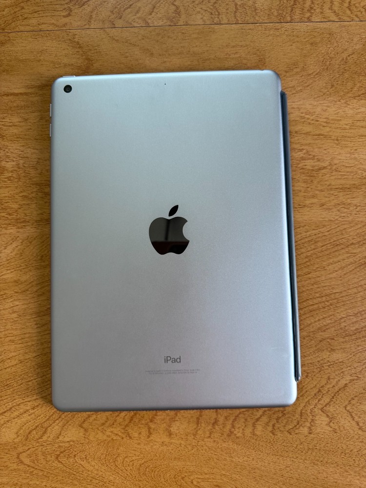 Gently used Apple iPad (5th generation) with Smart Folio case and charging cable