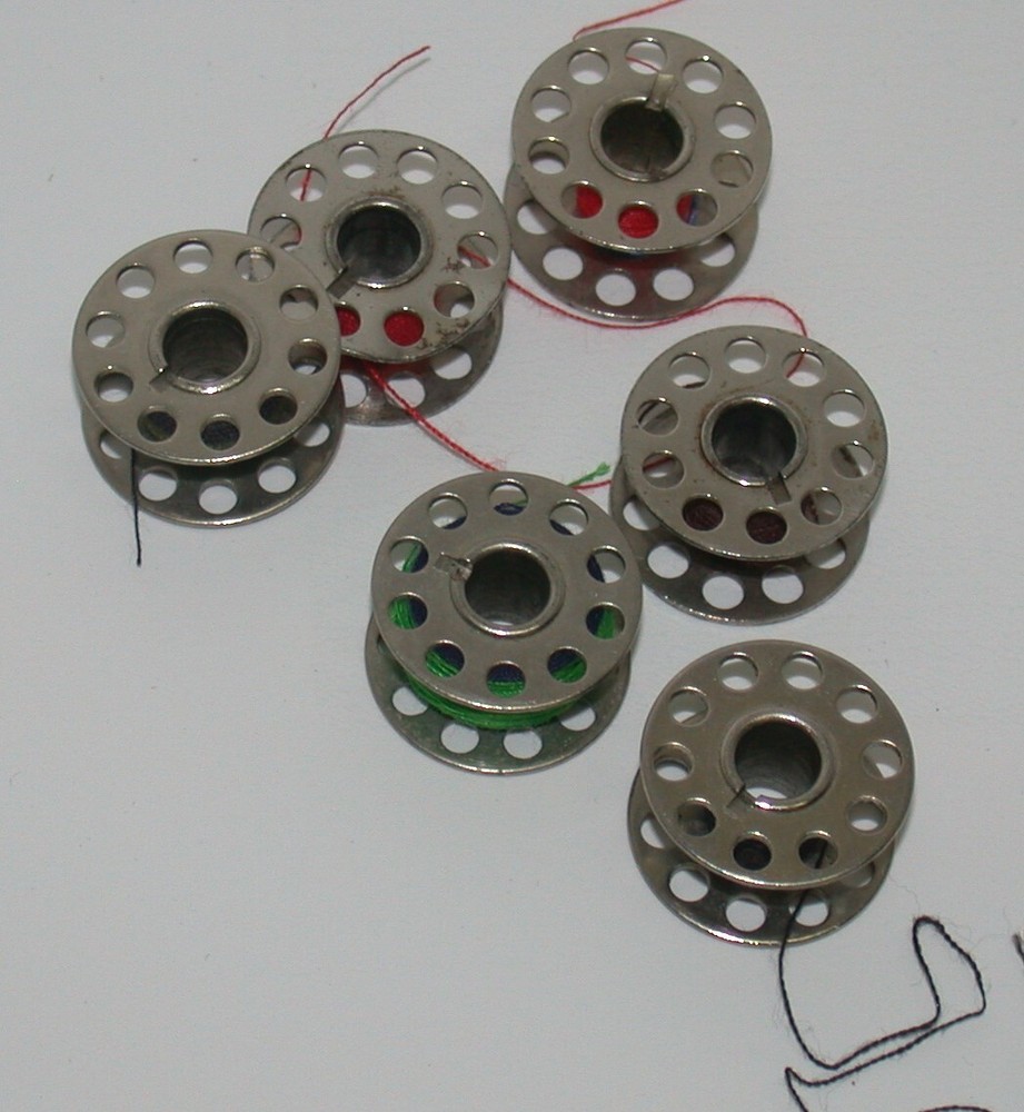 6 Unbranded Metal Bobbins Flat Surface