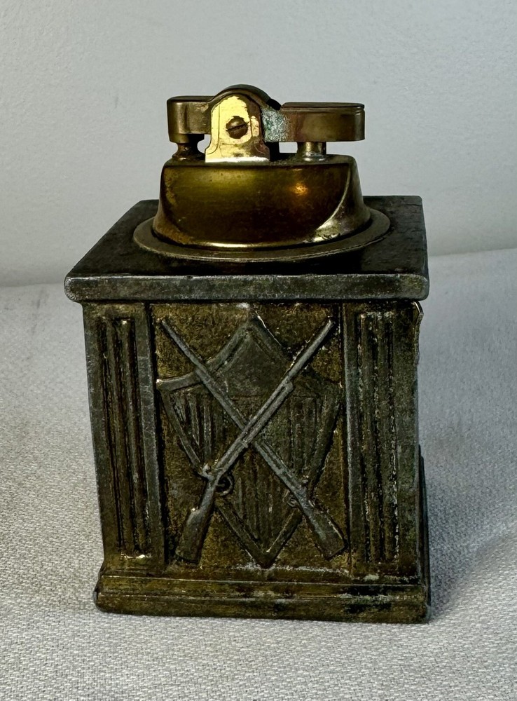 Brass Table lighter with crest/ rifle & sword motif