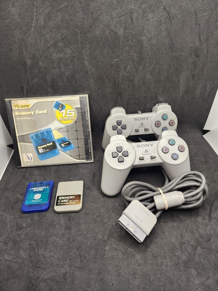 2 Playstation Controllers And 2 Memory Cards