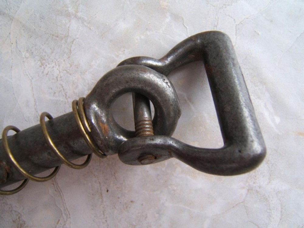 ANTIQUE SPRING-LOADED CAST-IRON BULL LEADING TOOL
