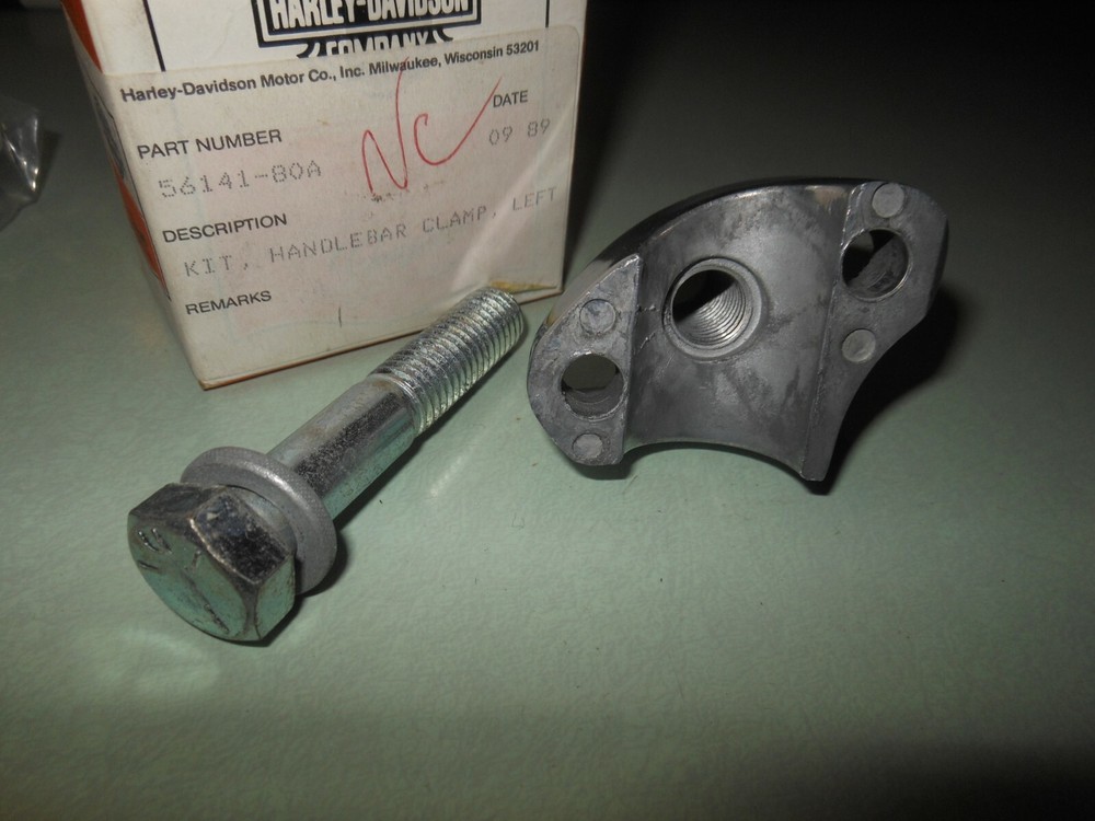 NOS OEM Harley Davidson Lower Handlebar Clamp + Bolt # 56141-80A
