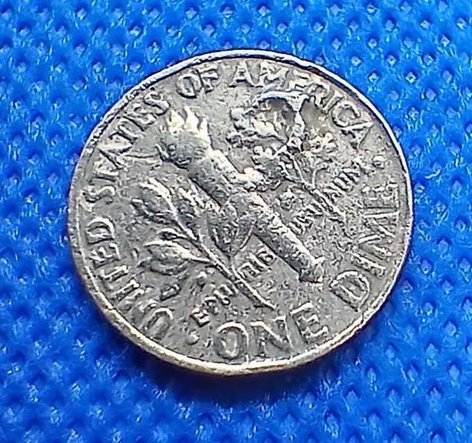 1 - 1986P Roosevelt Dime. Features various errors front and back.