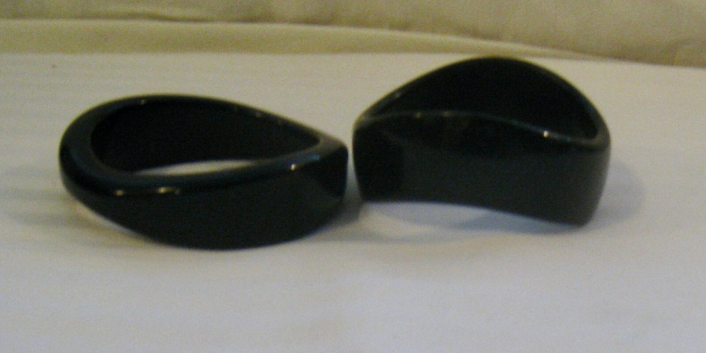 PAIR MID-20TH C. MODERN BLACK TORQUED QUALITY PLASTIC BANGLES: