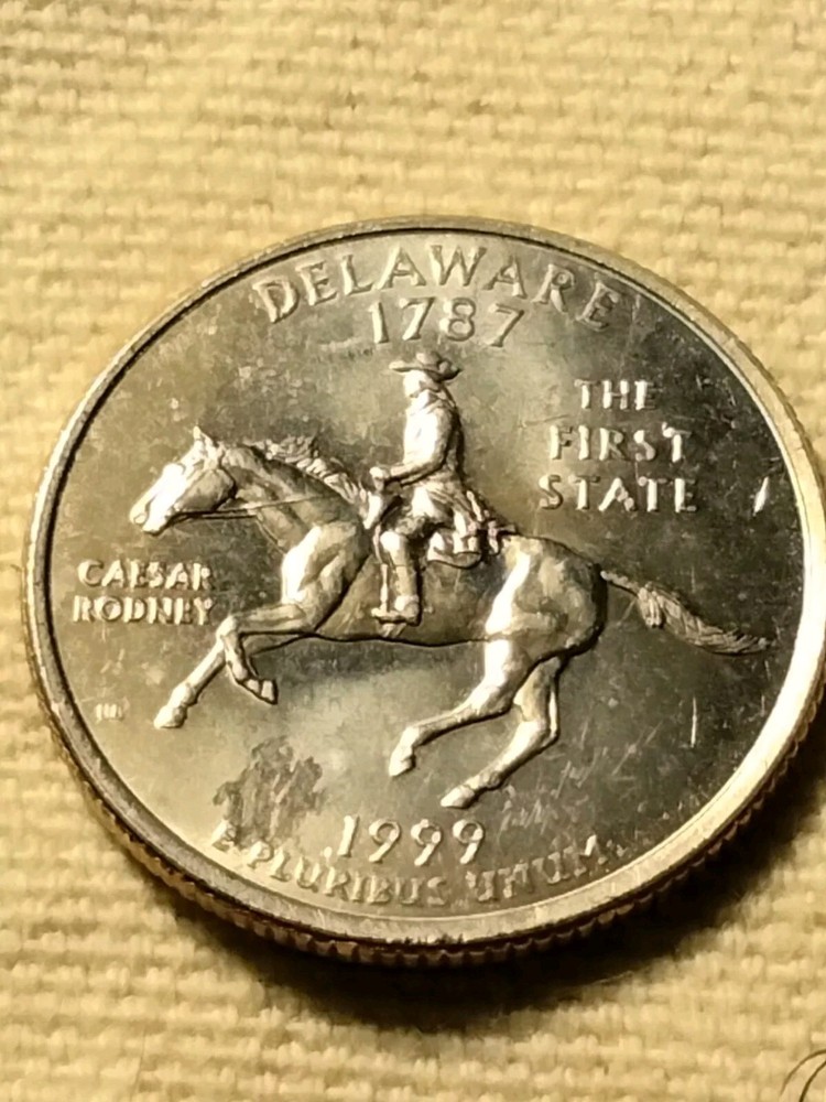 1999 D State Quarter Misaligned Die Struck Thru Grease