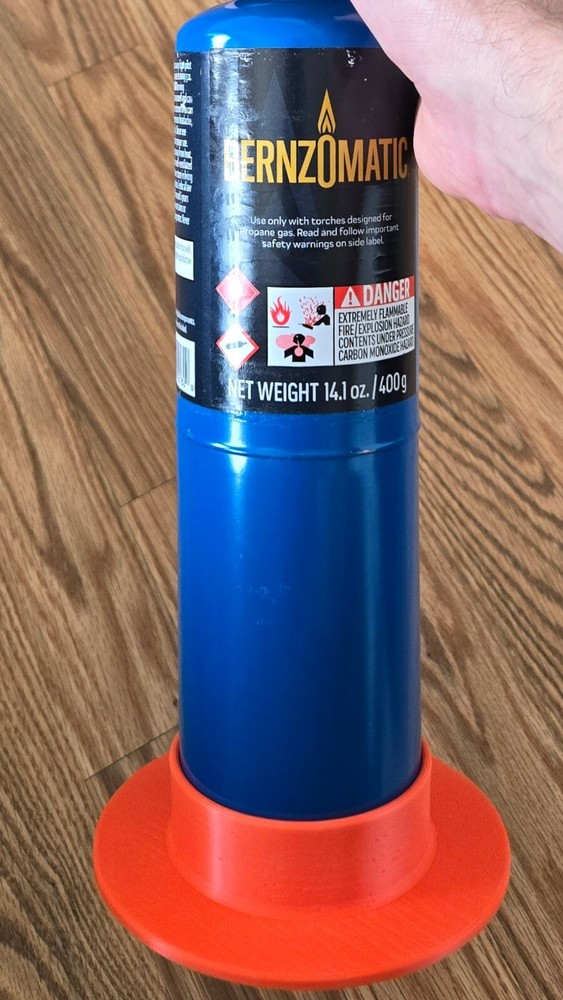 Anti-tip base for torch bottle
