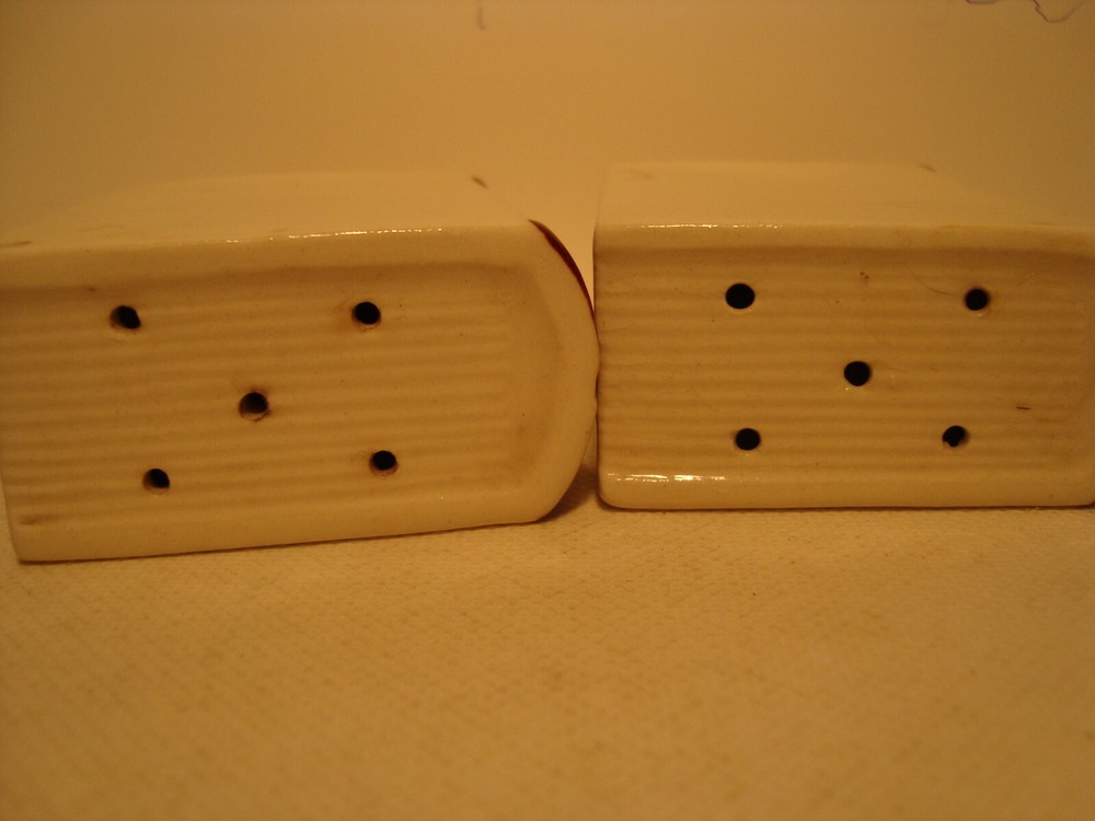 White porcelain book shape salt & pepper shaker set.