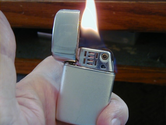 '' FIGMO '' LIGHTER LOOKS AND WORKS GOOD MADE BY RONSEN NOT RONSON