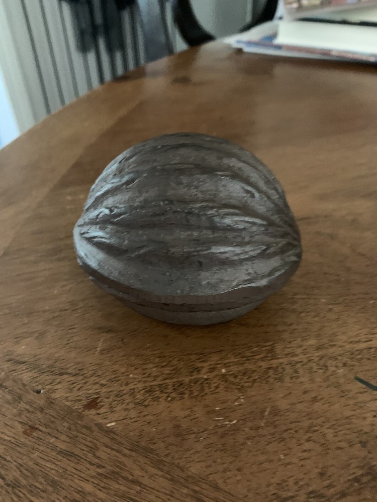 cast iron walnut shaped paper weight brown