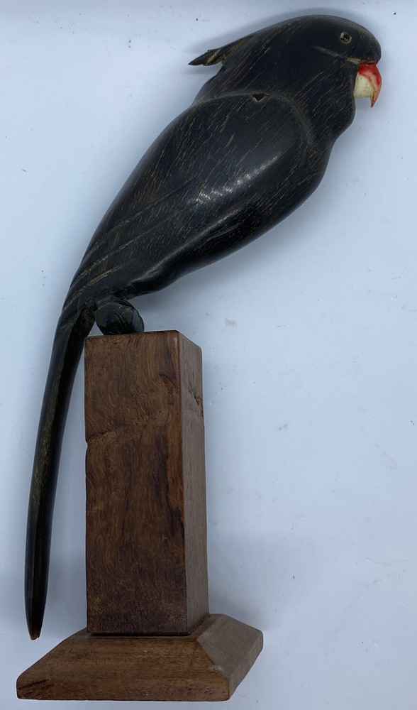 carved parrot on perch