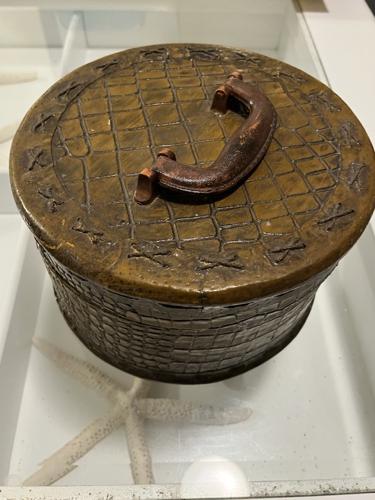 Wood basket with alligator pattern and silk lining.