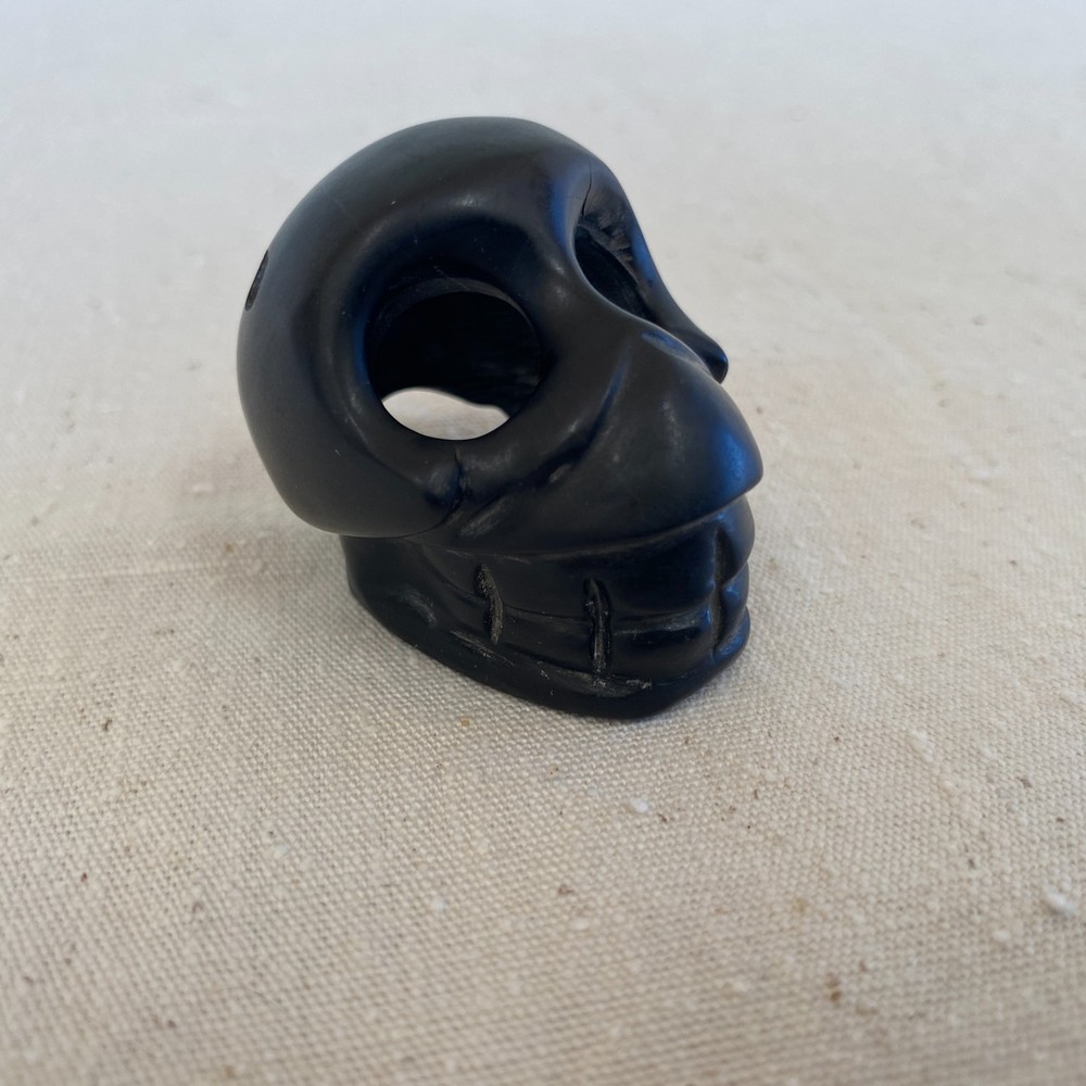 Stylized Carved Stone Skull Pendant