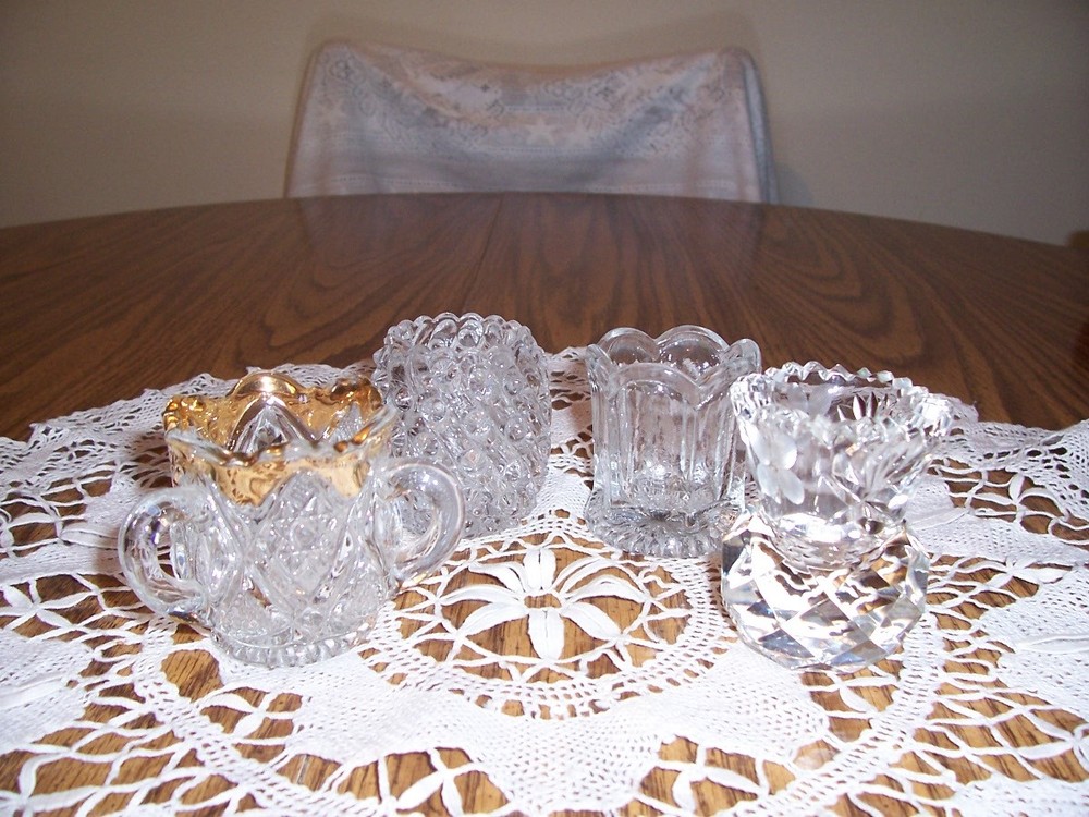 FOUR NICE GLASS TOOOTHPICK HOLDERS