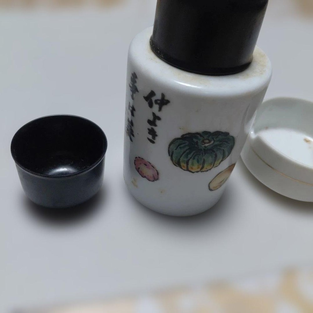 Ceramic sake bottle and cup set