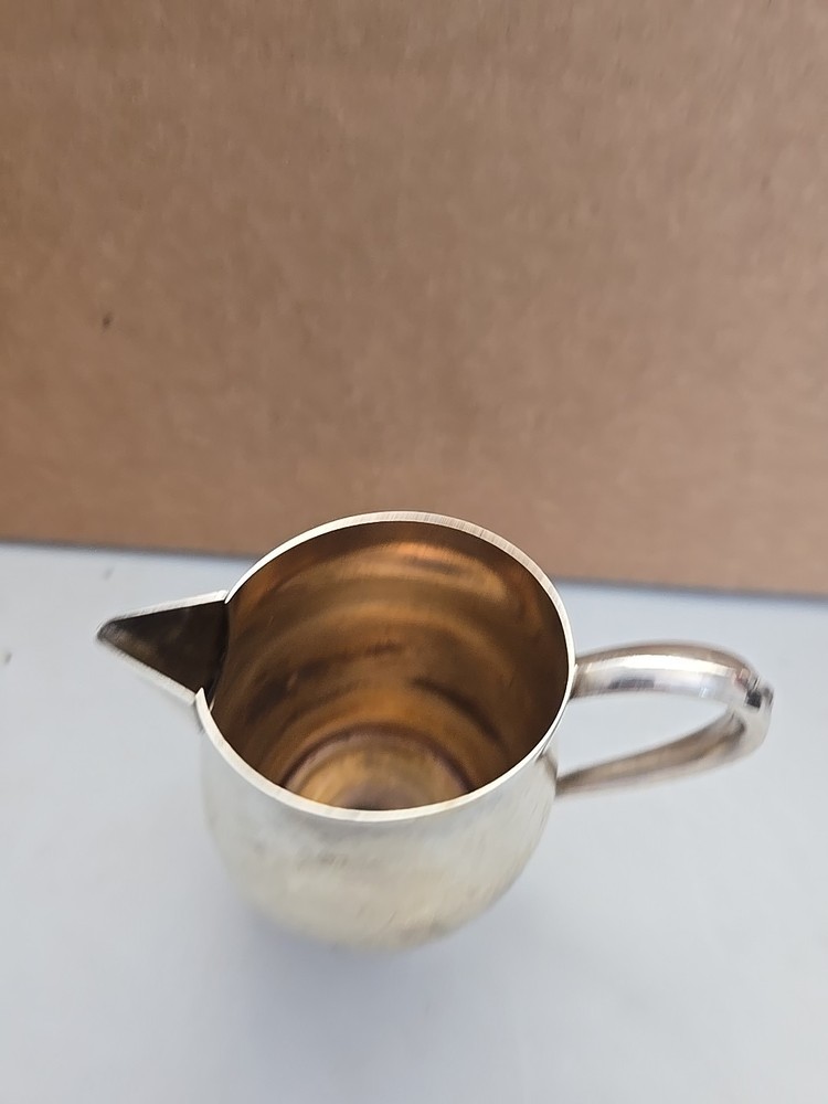 Oneida Silversmiths Sleek Design Creamer.
