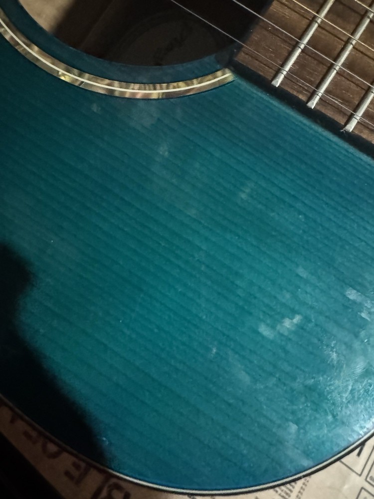 Blue-teal Playmate Guitar