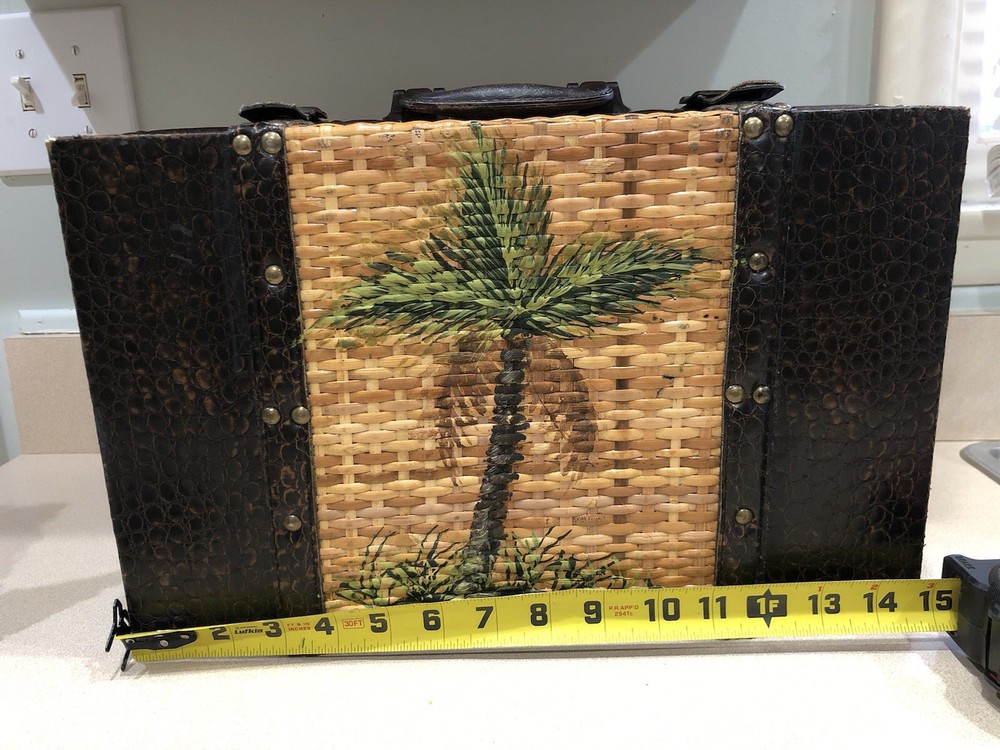 Vintage Ature trunk featuring a hand-painted palm tree