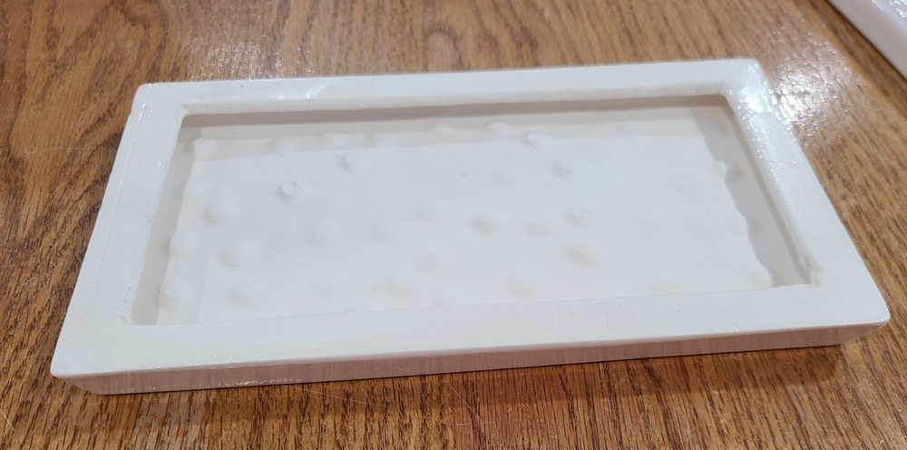 Ceramic Breadboard 8 1/2" x 4 3/4" Front is Glazed, back is unfinished Bisque