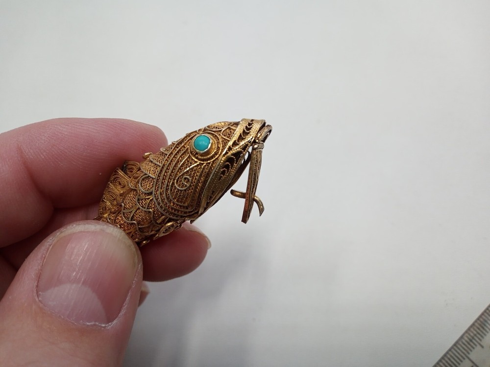 Tested as silver and gilded flexible fish, possibly pill box.