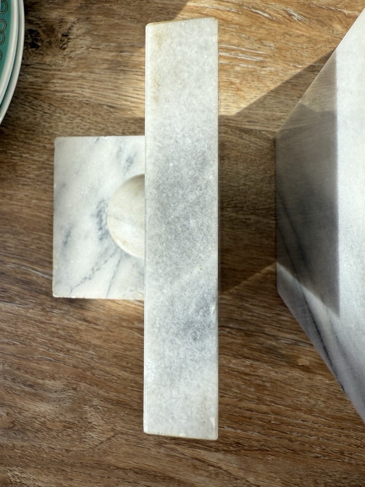 Vintage marble bookends with spherical elements.