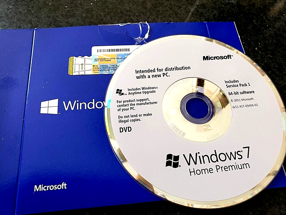 Assorted Software CDs & Logitech Manual (Windows 7, Word Perfect & Linksys)