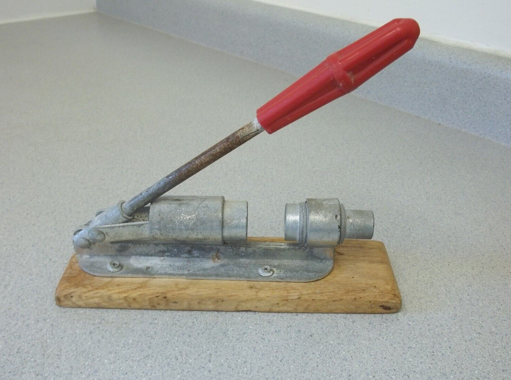 Nutcracker with red handle knob on wooden base Vintage adjustable nutcracker