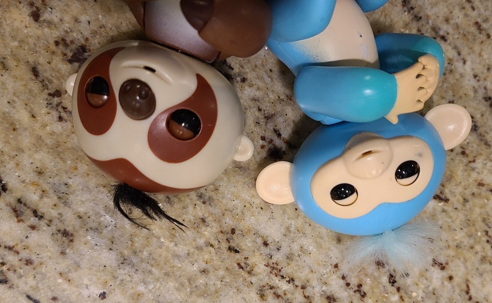 2 Fingerlings Interactive Baby Monkey Blue Brown Toys. Both work tested.