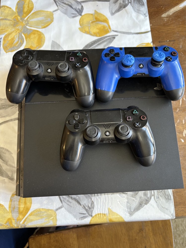 Sony PlayStation 4 1TB Bundle with Controller, Cords, and Games