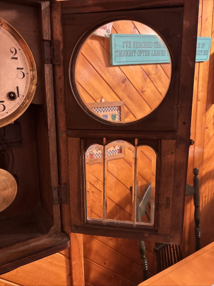 Vintage spring pendulum clock made by Meiji Clock Co.