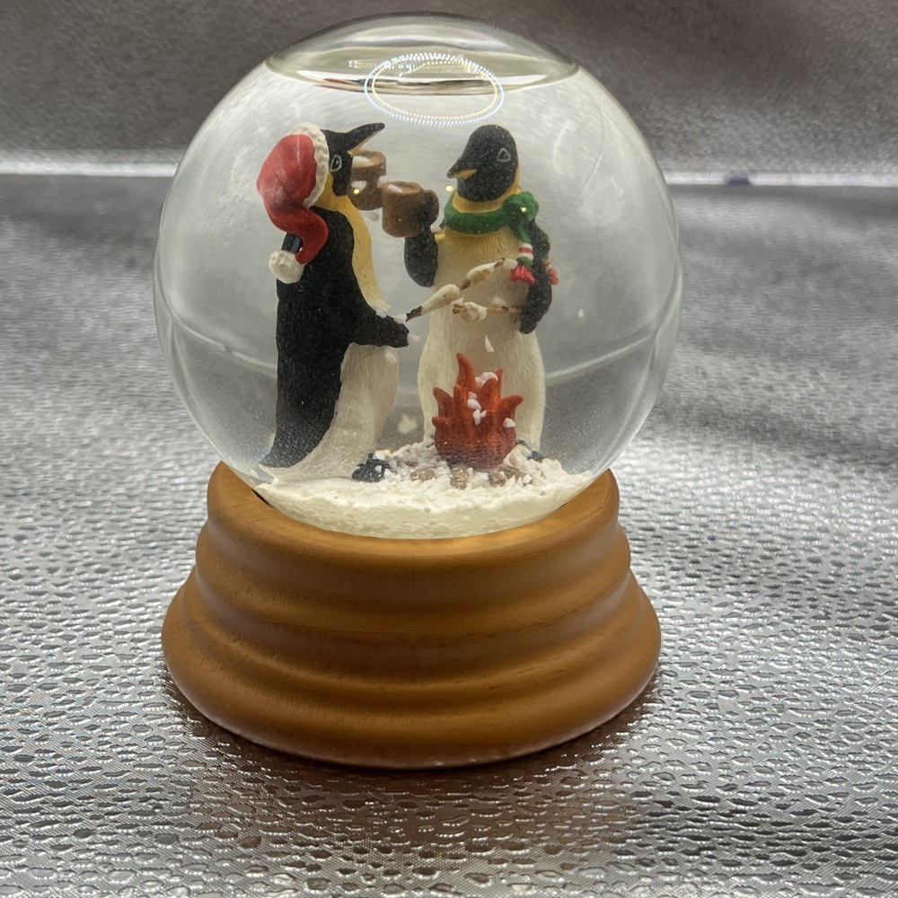 Eddie Bauer Penguin Snow globe 2002 Open Fire Roasting Marshmallows