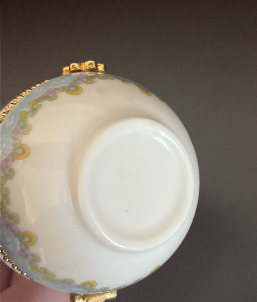 porcelain trinket box with brass clasp