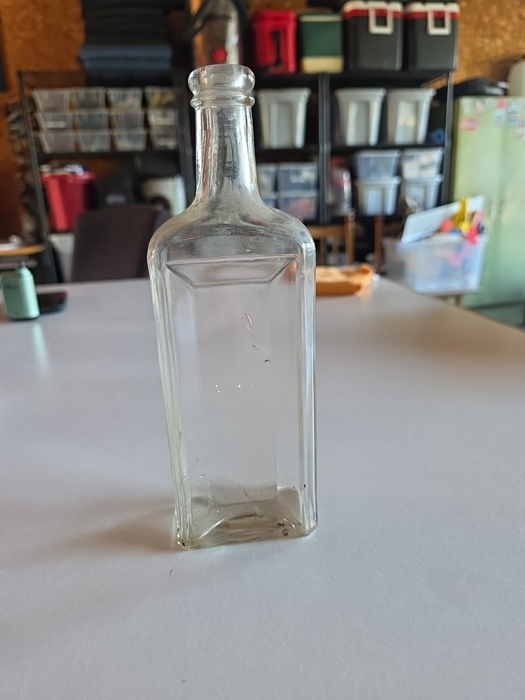 Vintage clear glass bottle