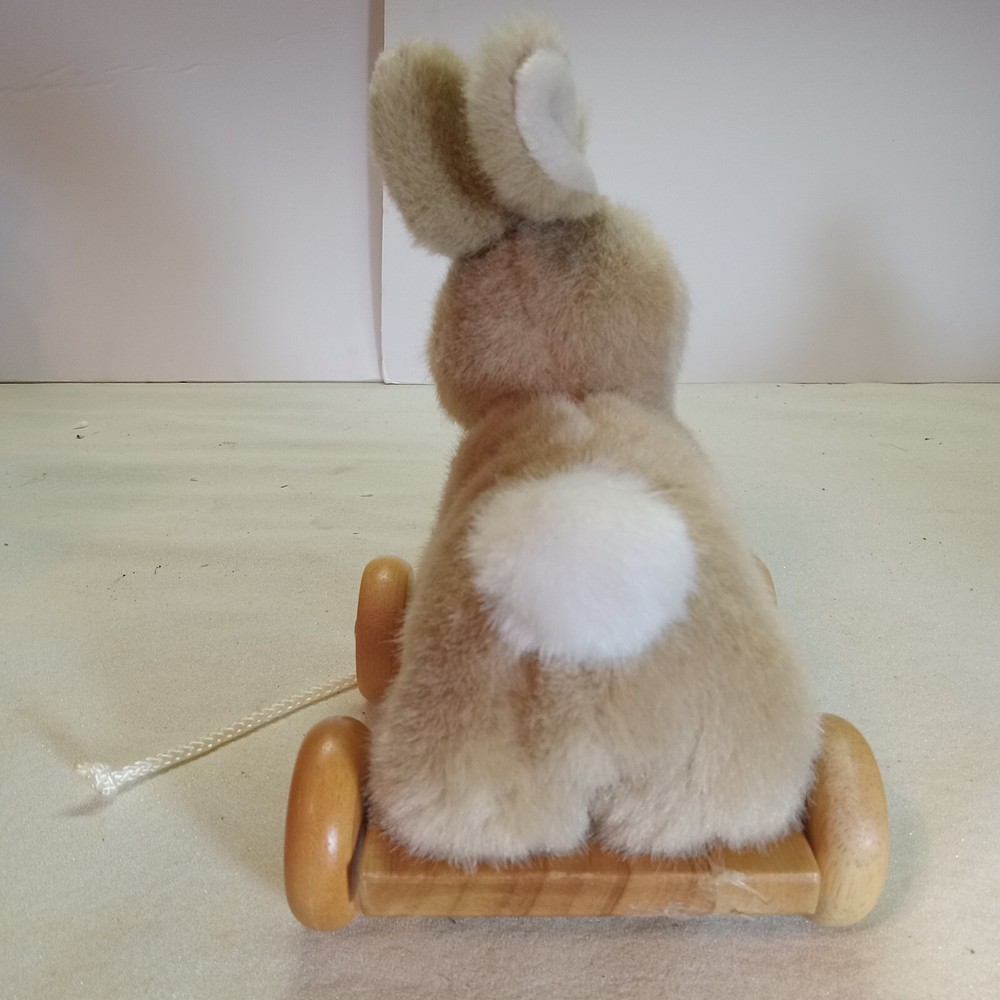 A bunny & duck on wheels pull toy