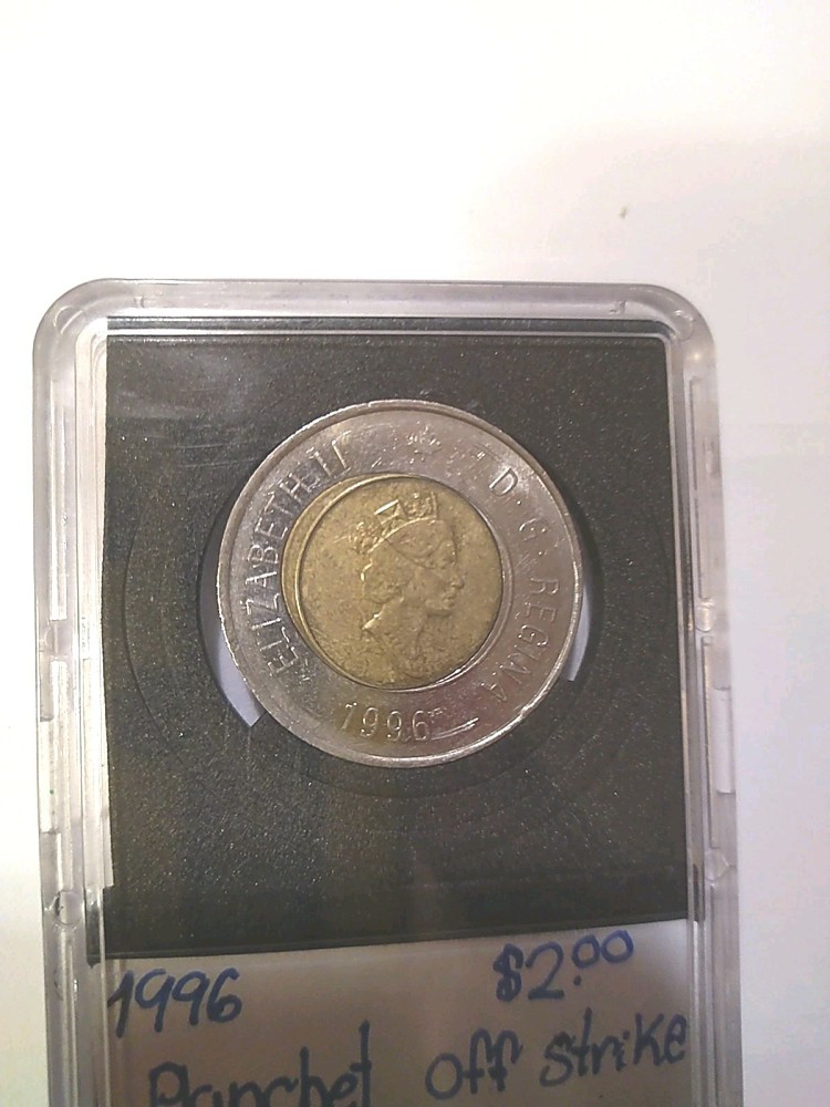 RARE MINTING ERROR 1996 CANADA $2 COIN. OFF CENTRE PLANCHET STRIKE ERROR.