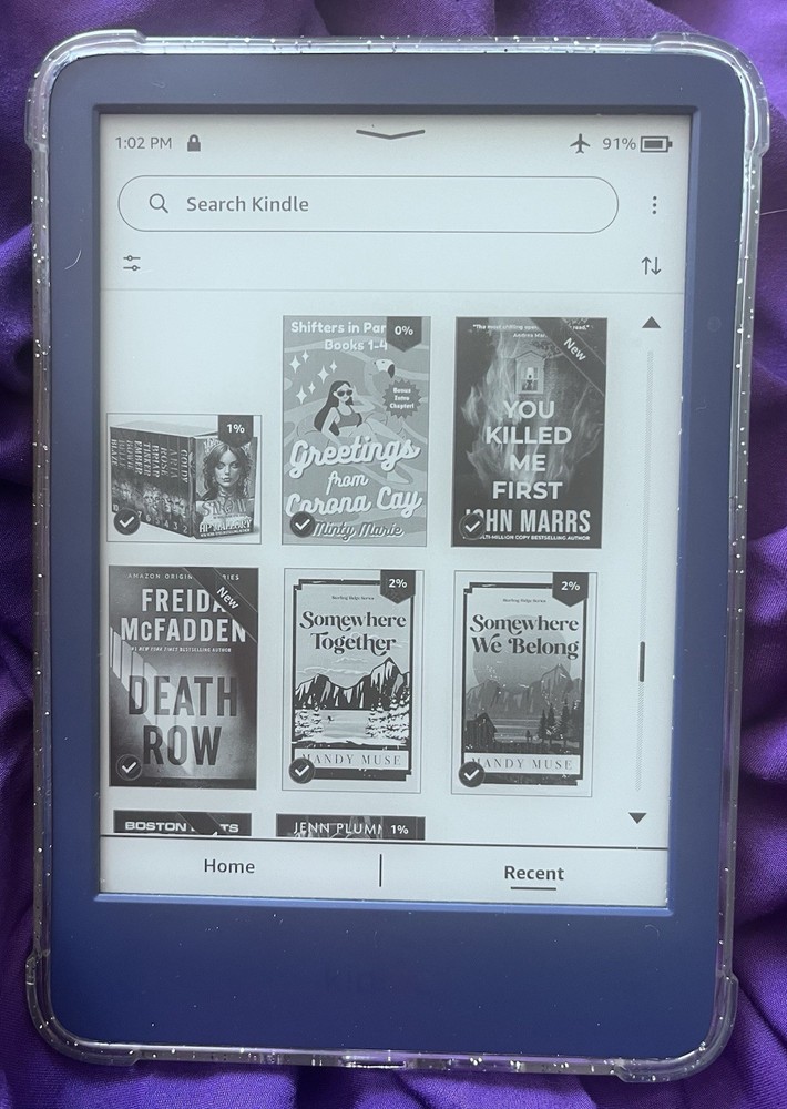 Amazon Kindle ereader Blue with books