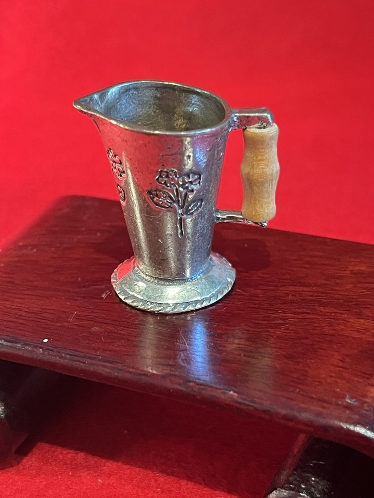silver miniature pitcher a/ wood handle marked "Blue Marine"