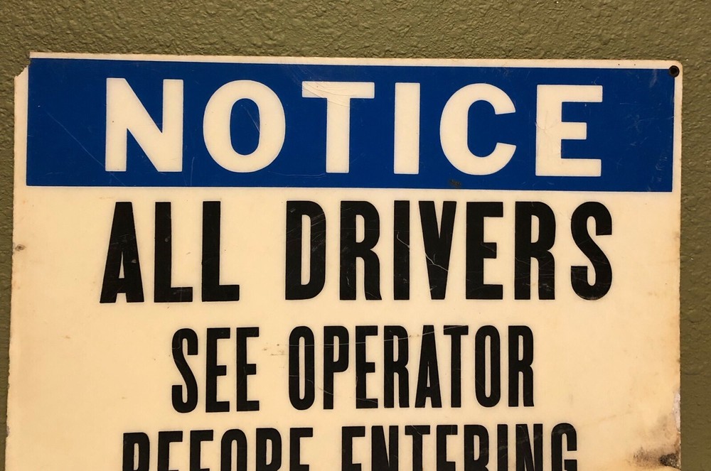 Vintage "NOTICE ALL DRIVERS SEE OPERATOR BEFORE ENTERING" LAMINATED SIGN