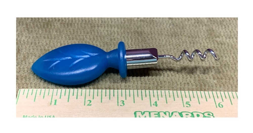USUAL CORKSCREW REMOVER PULLER TOP MADE OF VERY HARD MATERIAL, NOT SURE?